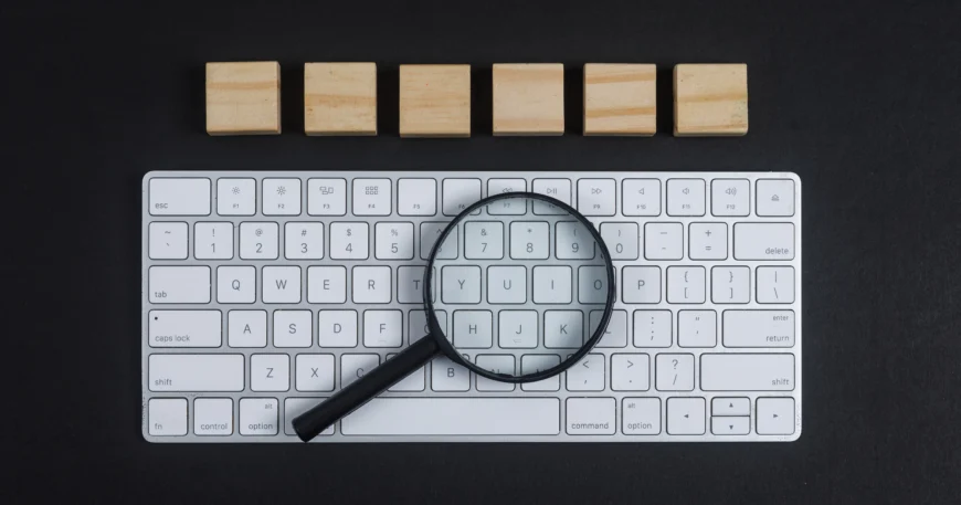 Keyword Research: magnifying glass on Laptop Keyboard